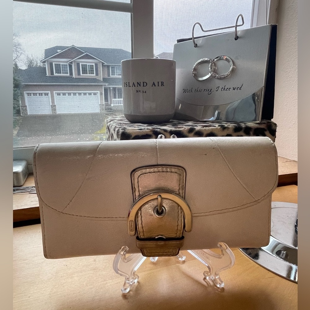 Coach Buckle Snap Wallet in cream and metallic gold.